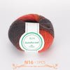 A ball of multi-colored wool yarn featuring shades of orange, red, and gray.