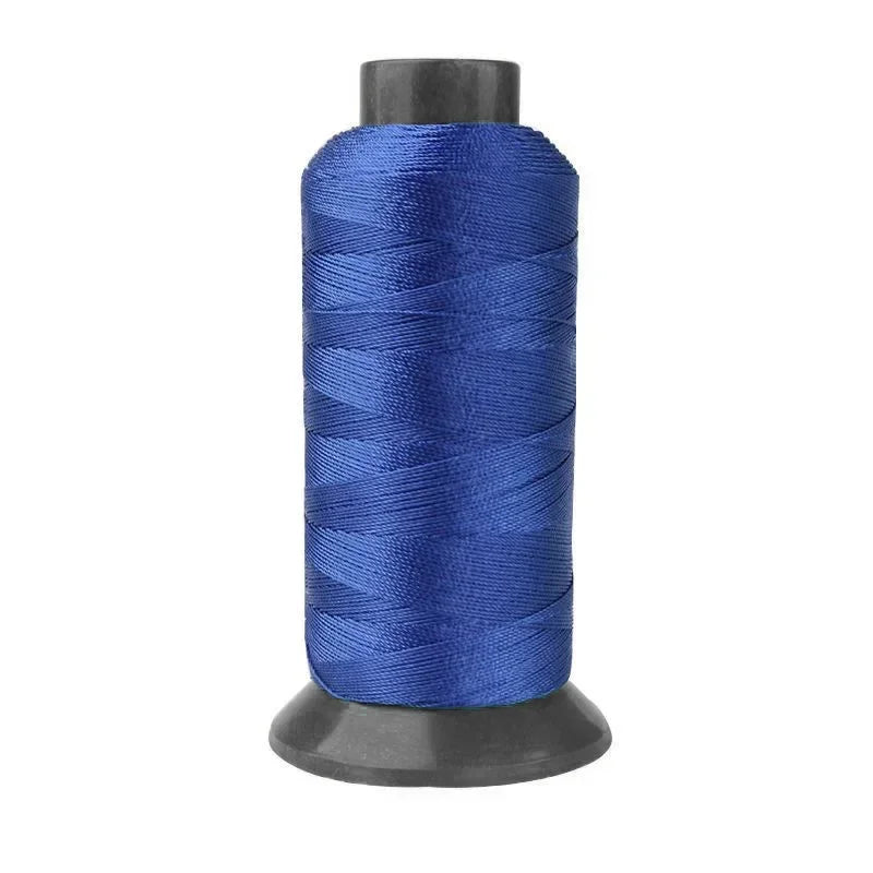 A roll of heavy duty 3-ply nylon sewing thread in a deep blue color.
