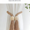 Hand-woven wooden curtain tiebacks in beige rope with round wooden accents