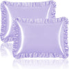 A set of two ruffled satin pillowcases in light purple with silky envelope closures.