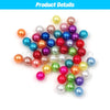 A collection of various colored pearl beads, including pink, purple, blue, and white, arranged on a white background.