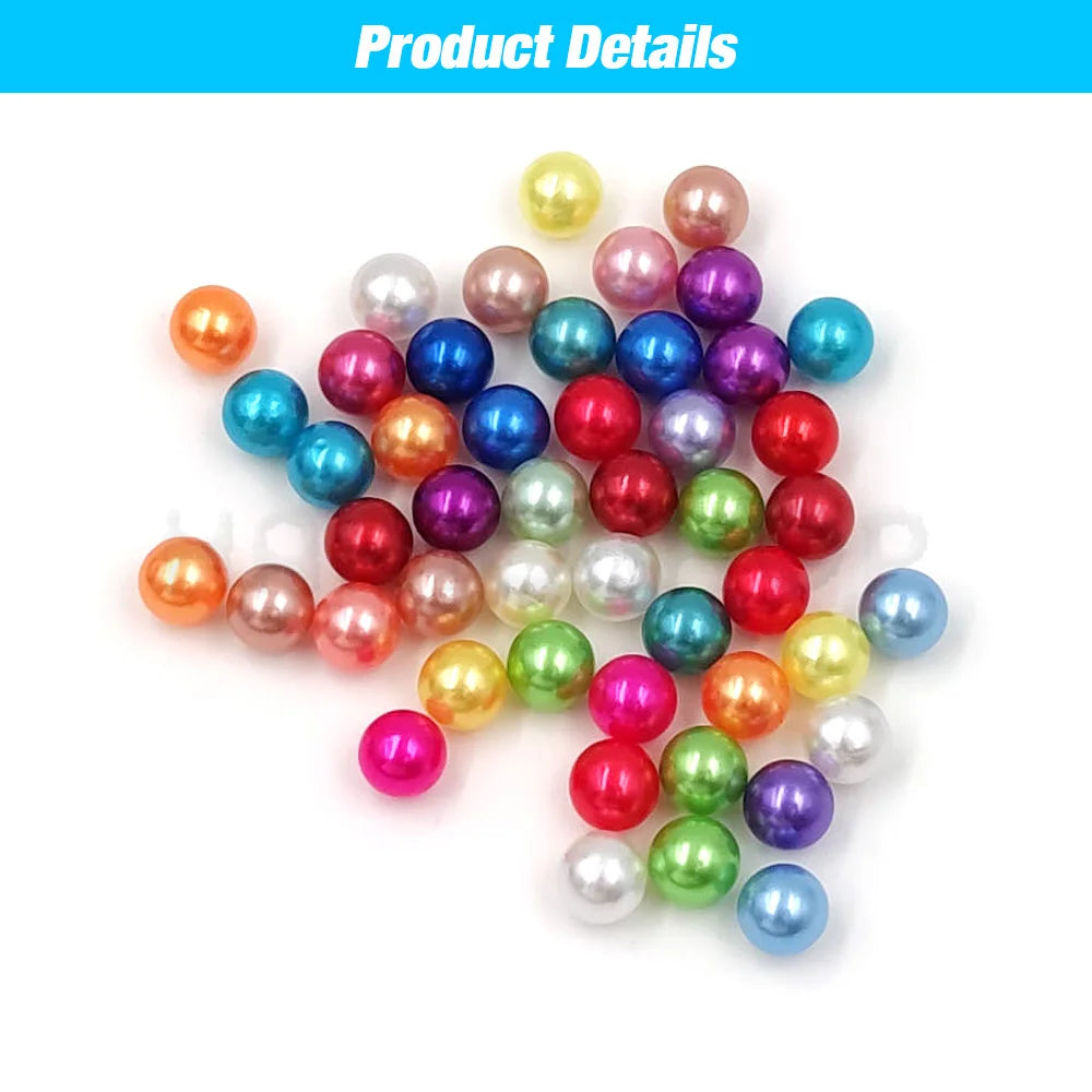 A collection of various colored pearl beads, including pink, purple, blue, and white, arranged on a white background.
