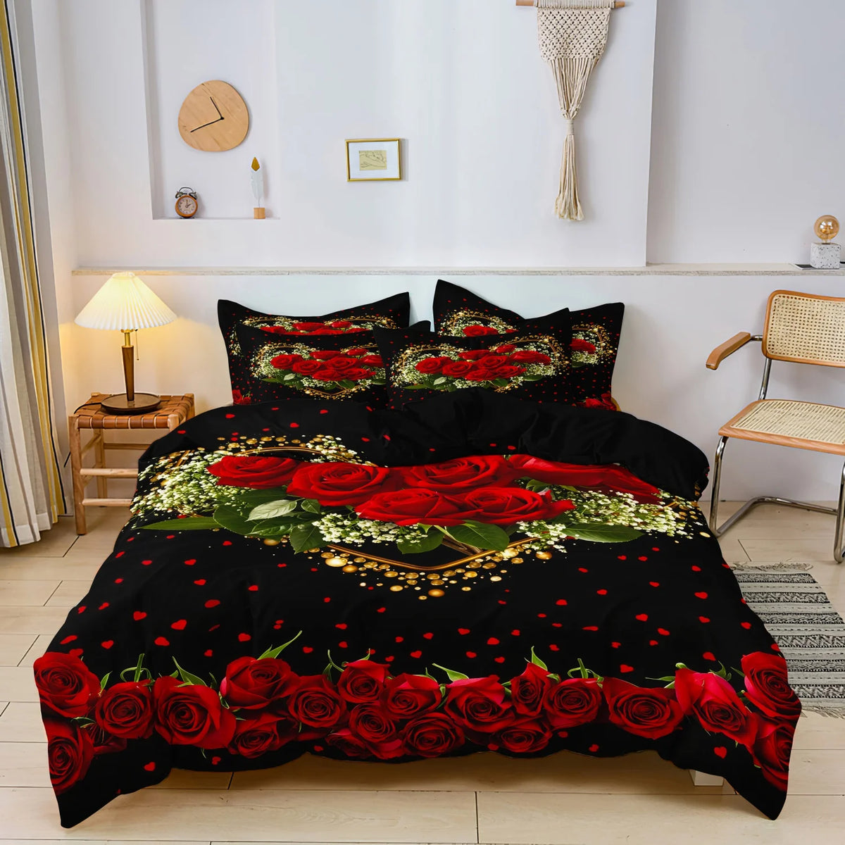 A black bedding set featuring a vibrant red rose pattern with gold accents and green foliage.