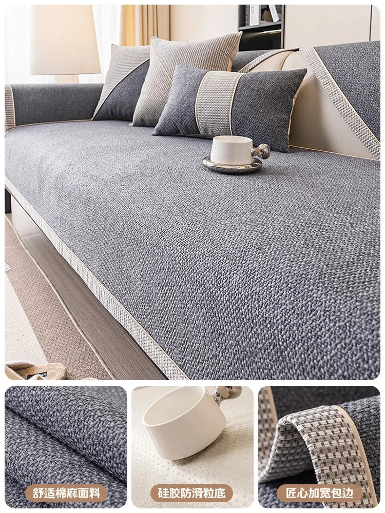 Gray woven sofa cushion cover with beige accents and a white cup on a light-colored fabric.