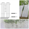 White vintage floral lace curtains displayed hanging and laid flat, showing the delicate pattern and fabric texture.