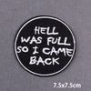 Black circular embroidered patch with white text that reads Hell was full so I came back