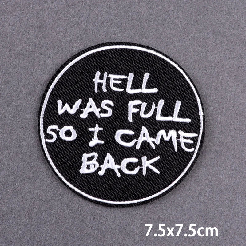 Black circular embroidered patch with white text that reads Hell was full so I came back