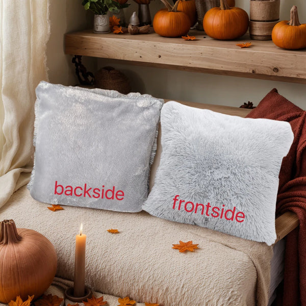 Two gray faux fur throw pillow covers labeled backside and frontside resting on a beige fabric.