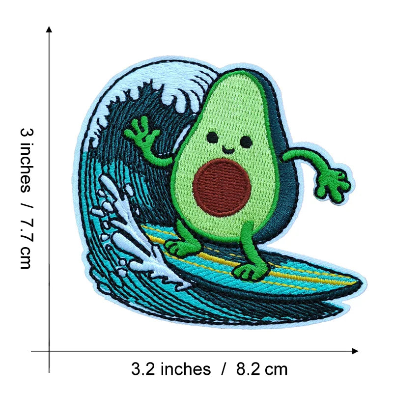 An embroidered patch depicting a smiling green avocado character swimming in blue and teal ocean waves.