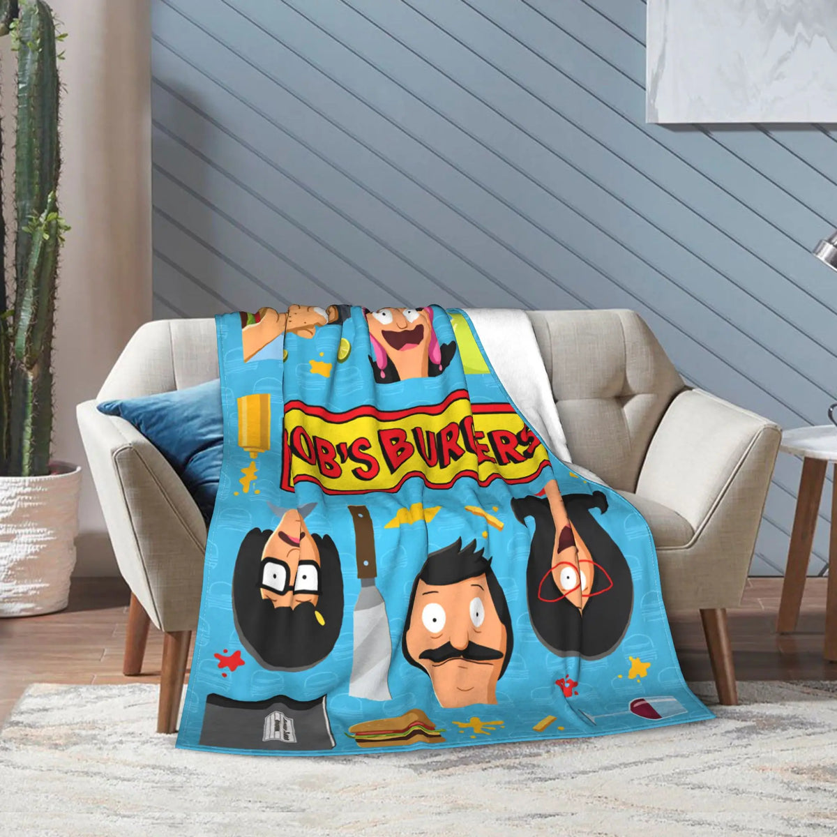 A colorful throw blanket featuring characters from Bob's Burgers, including Tina Belcher and Linda Belcher.
