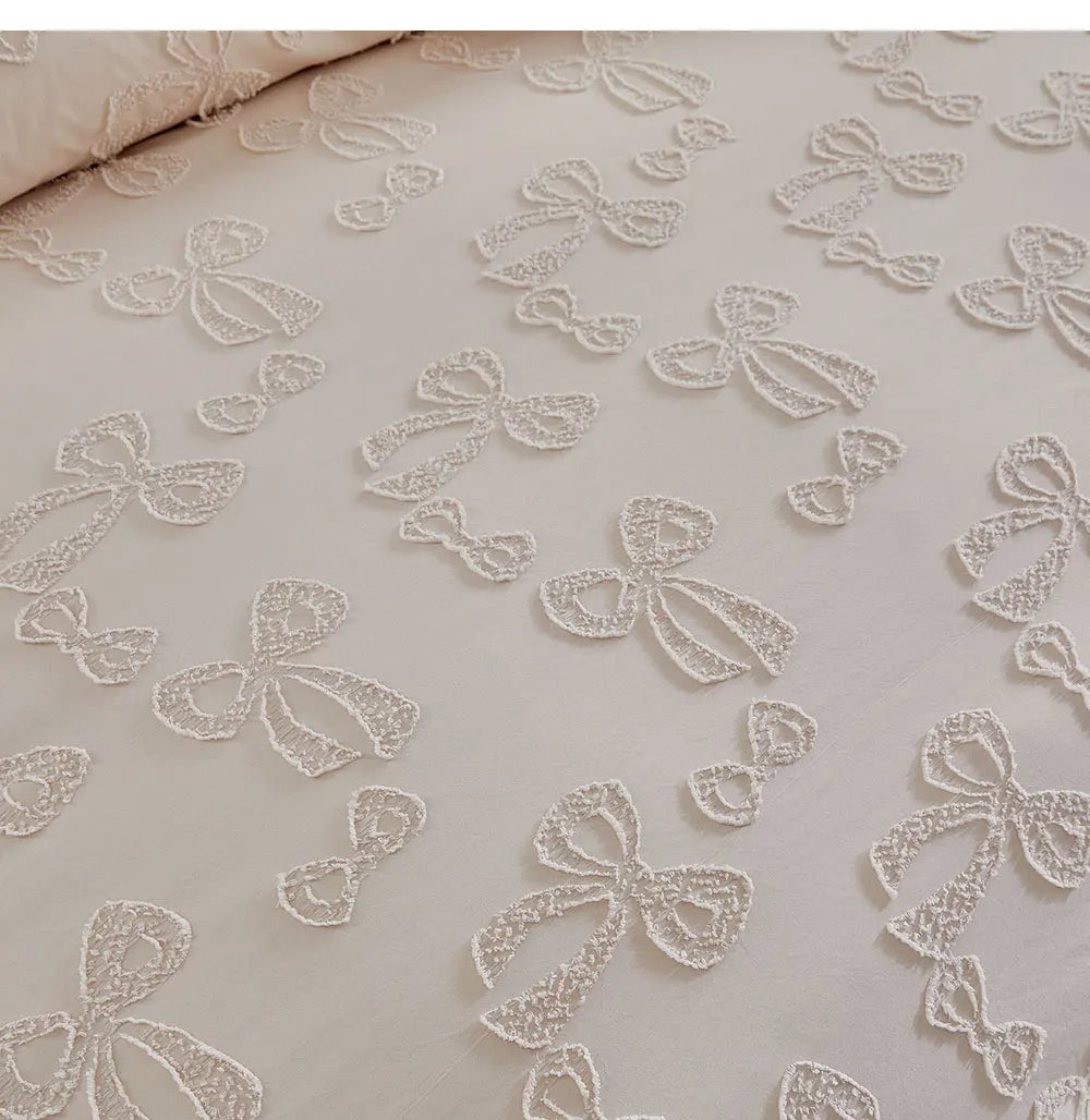 White linen duvet cover featuring delicate white embroidered floral patterns