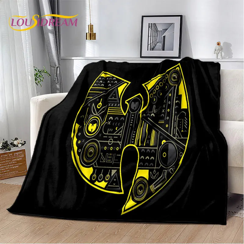 Black flannel throw blanket featuring a large yellow stylized letter N design
