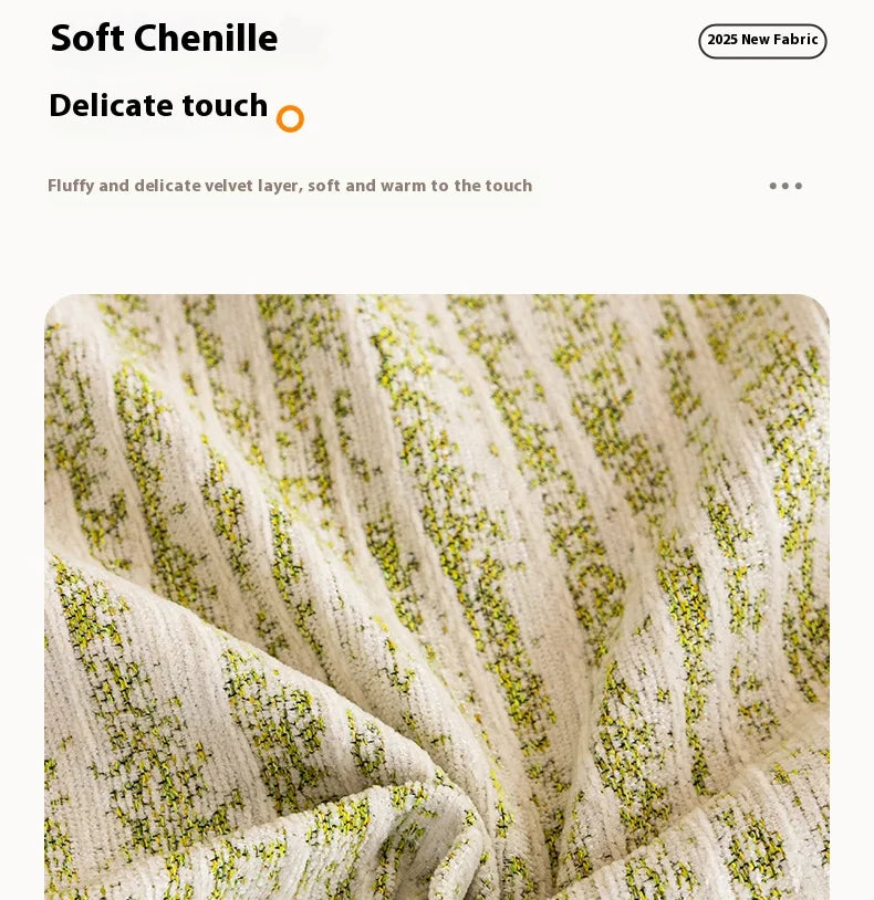 Close-up of a soft chenille fabric blanket with vertical stripes and scattered green flecks.
