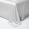 A smooth white luxury Egyptian cotton bed sheet draped elegantly on a surface.