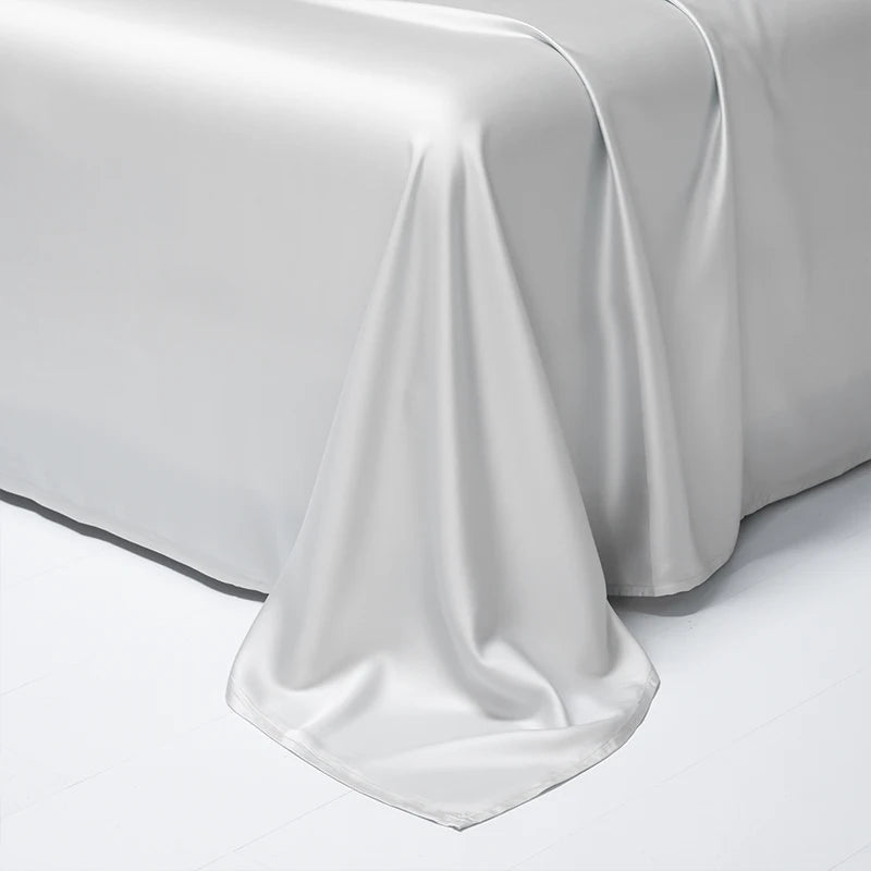 A smooth white luxury Egyptian cotton bed sheet draped elegantly on a surface.