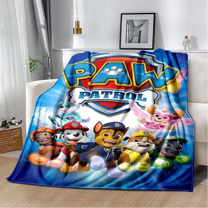A colorful Paw Patrol cartoon themed flannel throw blanket featuring characters like Chase and Skye.