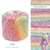 A ball of hand knitting yarn showing a vibrant gradient of pink, orange, and yellow threads.