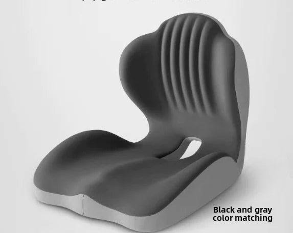 A gray ergonomic memory foam lumbar support cushion shown from the side.