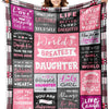A woman models a large purple and pink patterned throw blanket featuring inspirational quotes about love and being a daughter
