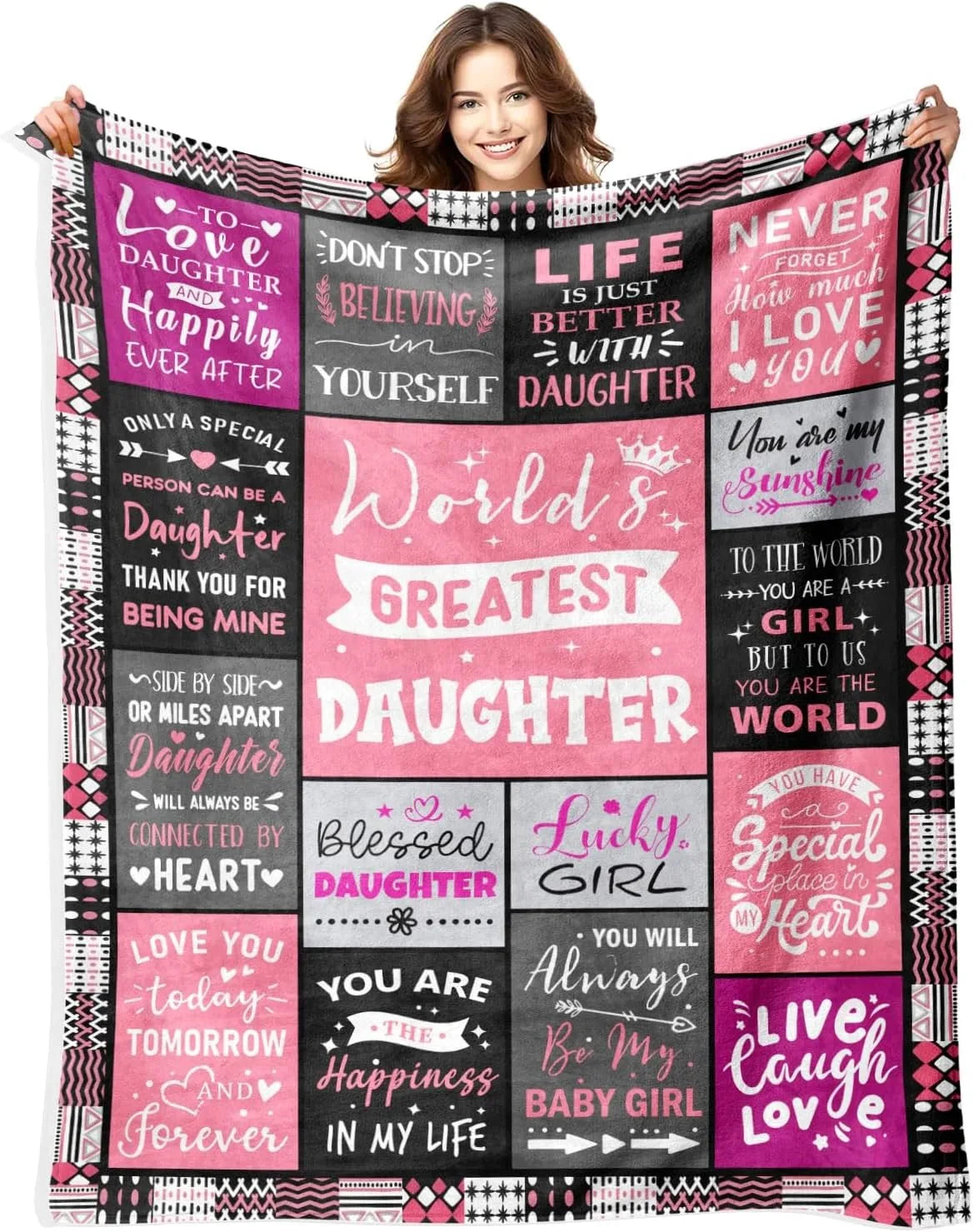 A woman models a large purple and pink patterned throw blanket featuring inspirational quotes about love and being a daughter