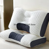 A white and dark gray adjustable ergonomic neck support pillow resting on a light-colored surface.