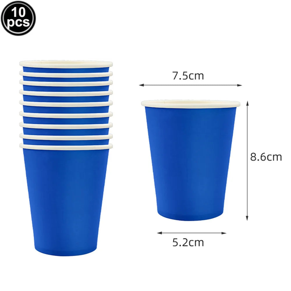A set of ten blue plastic cups with white lids and a rectangular blue tablecloth.