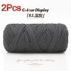 A skein of grey reusable elastic yarn is shown rolled up for crafting.