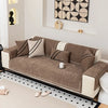 A luxurious chenille sofa protector cover in brown and cream tones displayed on a sofa.