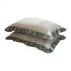 A set of two washed cotton pillowcases in a soft plaid pattern with ruffled edges.