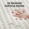 A hand is gently touching a white, textured massage cushion featuring a 3D massage particle design.