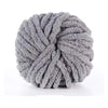 A ball of gray hand-woven chunky chenille yarn with a fuzzy texture.