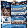 A dark blue knit blanket featuring inspirational text for a son including messages of love and pride