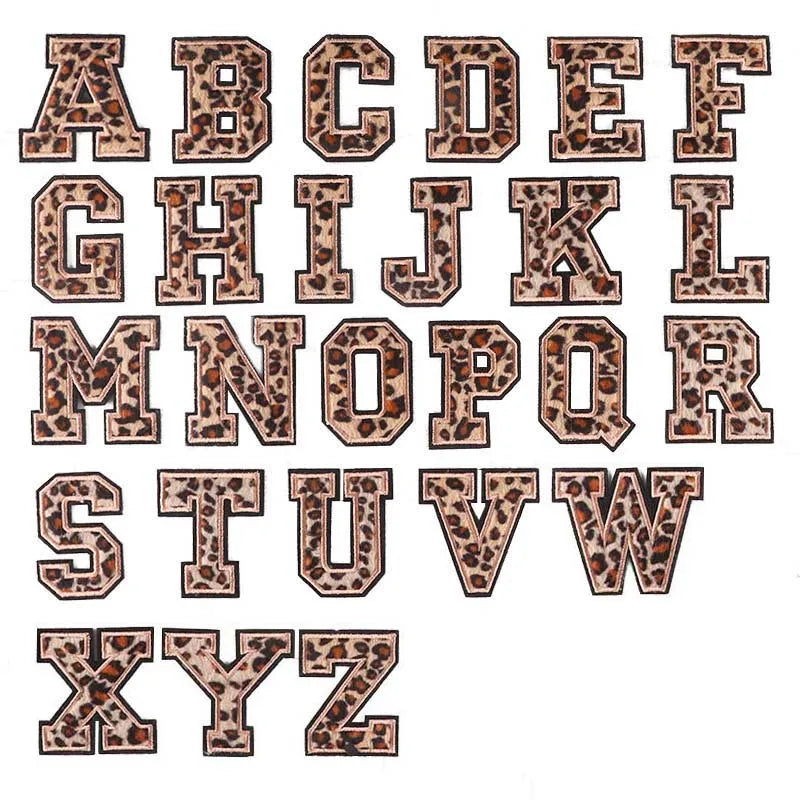 A full alphabet set of iron-on patches featuring a leopard print design.