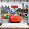 A vibrant Cars cartoon backdrop featuring Lightning McQueen and other race cars in a city setting.