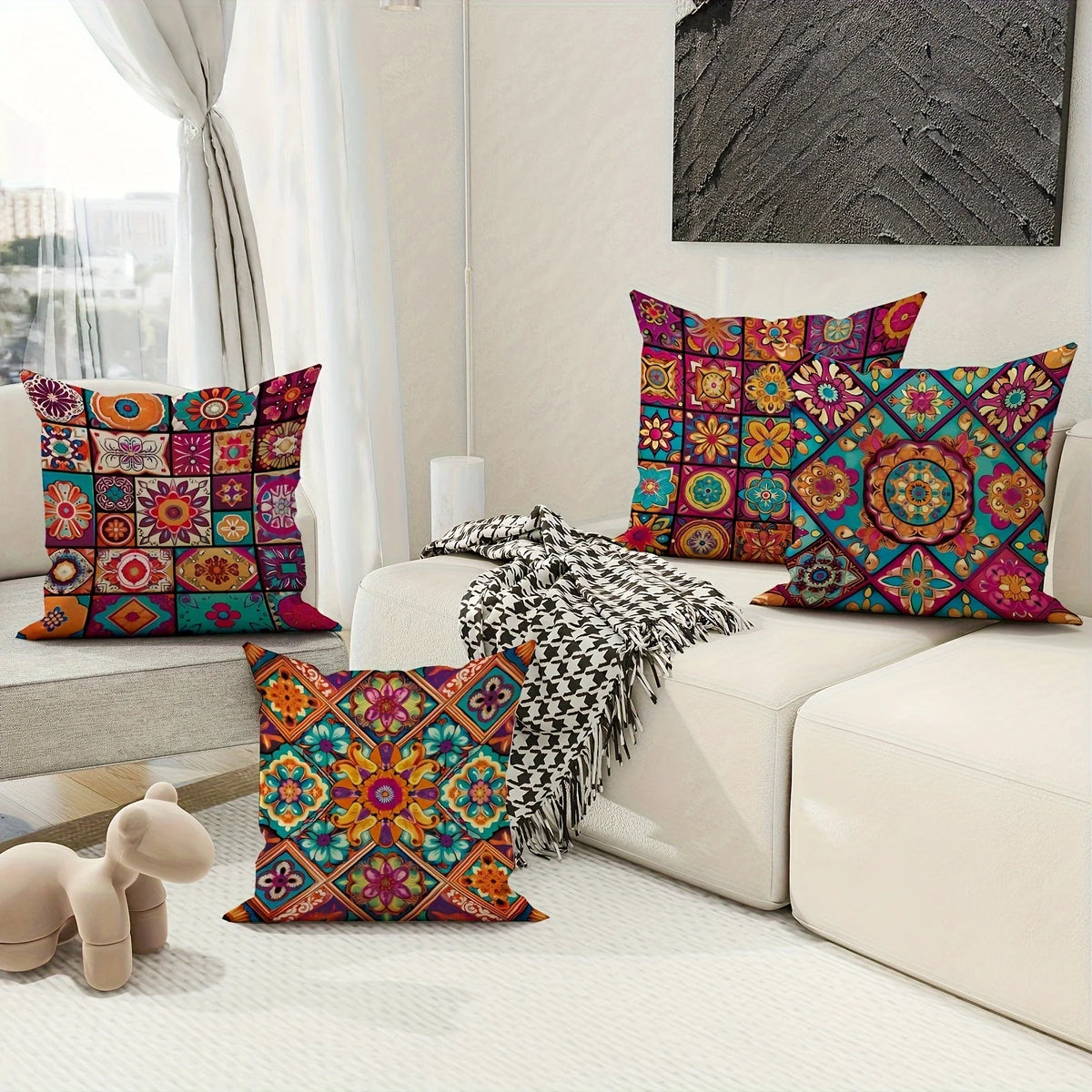 A collection of colorful boho chic mandala plaid pillow covers displayed on a white sofa.