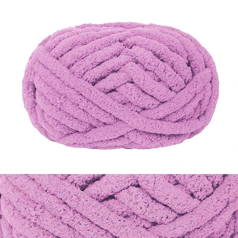 A ball of hand-knitted wool finger line scarf in a light purple color.