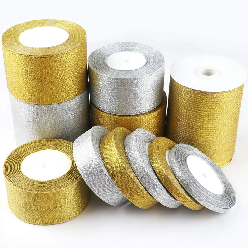 Rolls of glitter organza ribbon in gold and silver colors for gift wrapping and crafts