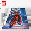 A blanket featuring an anime character in a red outfit against a starry blue background.