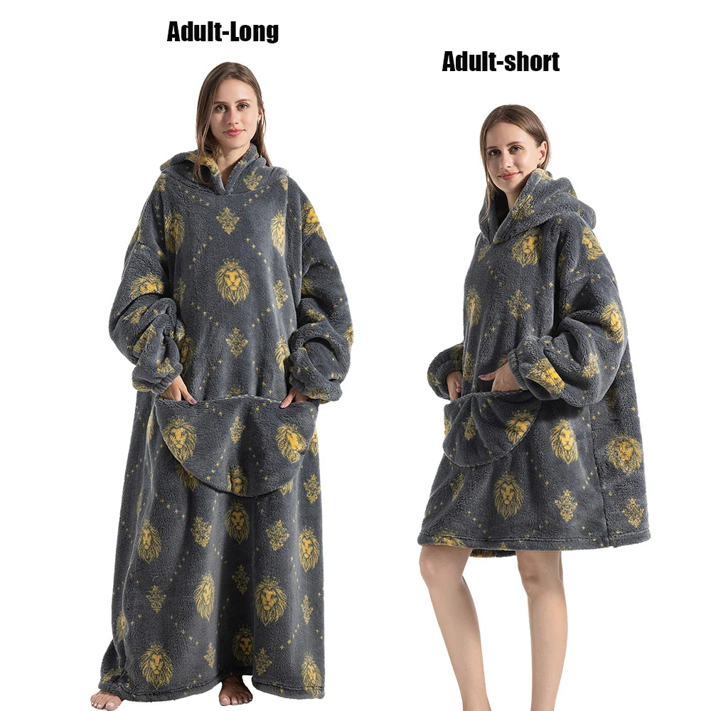 A woman models an adult-long gray and gold patterned plush fleece blanket hoodie and an adult-short version.