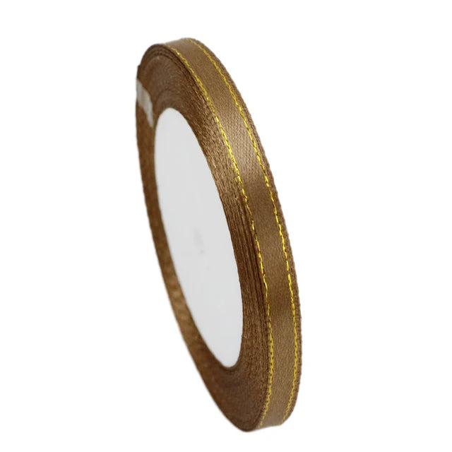 A roll of 6mm gold-edged satin ribbon for gift wrapping and crafts.