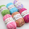 A collection of brightly colored premium milk cotton yarn skeins with traditional Chinese text labels.