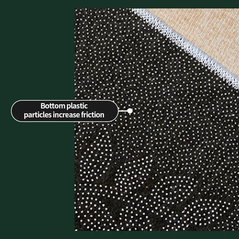Close-up view of a dark floor rug with white dots and a beige border, illustrating how bottom plastic particles increase fric