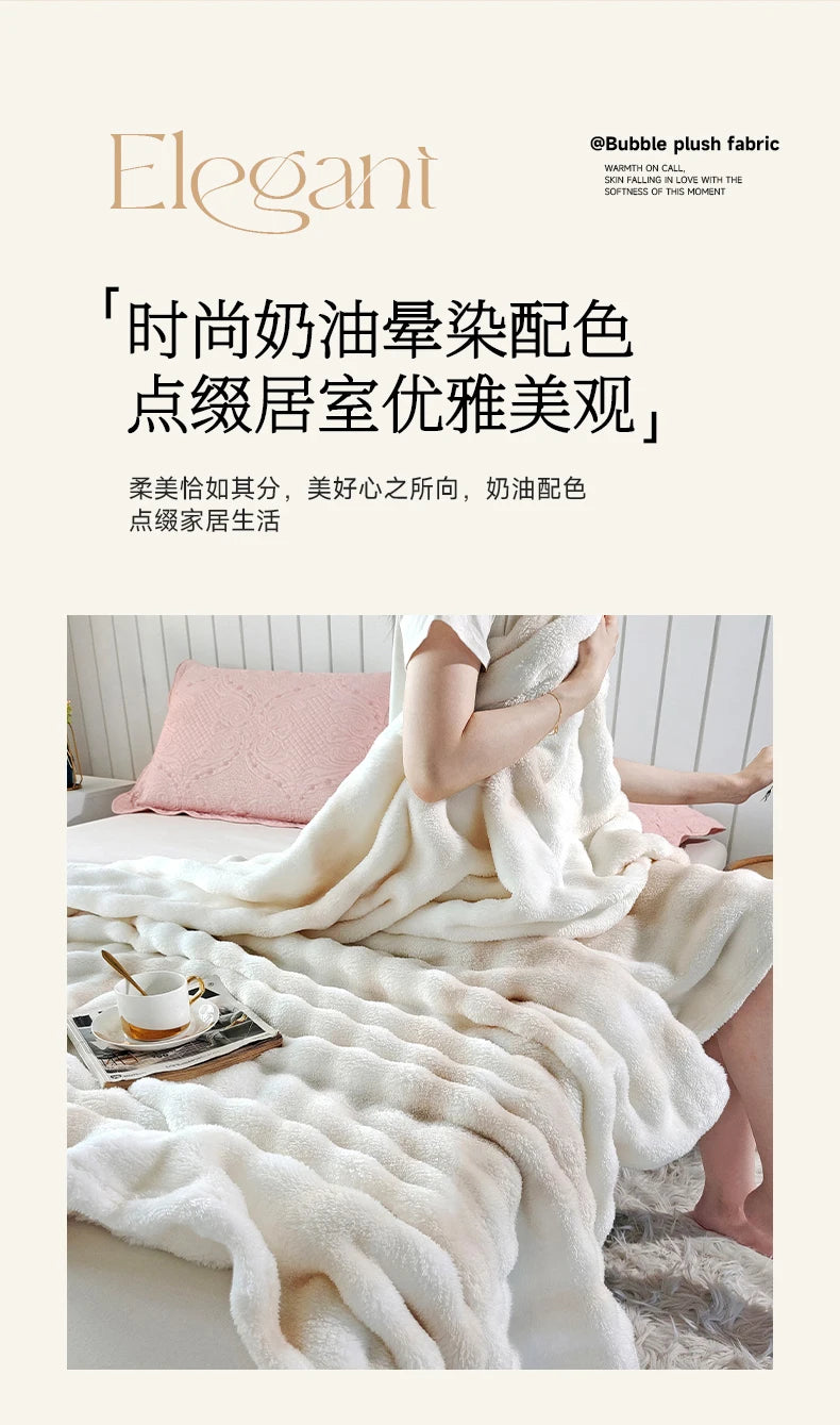 A fluffy white plush rabbit fur throw blanket draped over a person in a bright, soft indoor setting.