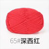A ball of bright red knitting yarn labeled 65# Deep Red.