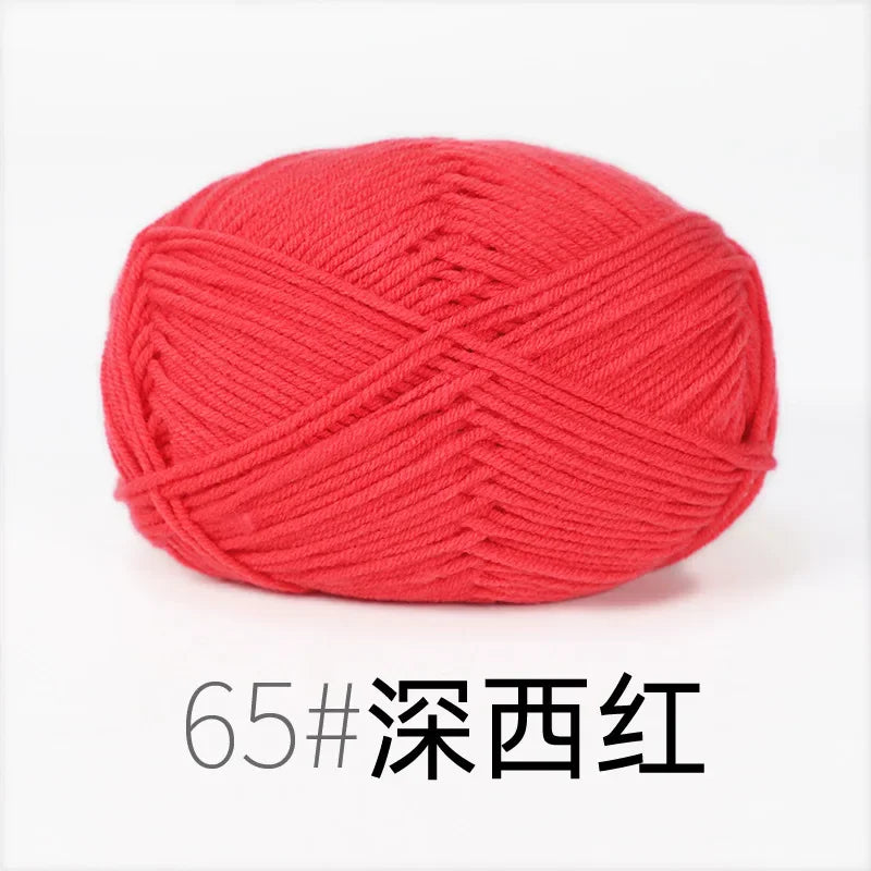 A ball of bright red knitting yarn labeled 65# Deep Red.