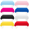 A collection of vibrant solid color rectangle tablecloths in blue, pink, magenta, black, white, and red.