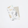 A folded soft cotton baby pillow cover featuring various animal patterns and a geometric print.