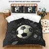 A soccer ball themed duvet cover set with pillowcases featuring a black and white patterned fabric on a bed.