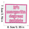 Pink embroidered patch with the text It's margarita degrees outside on a white background