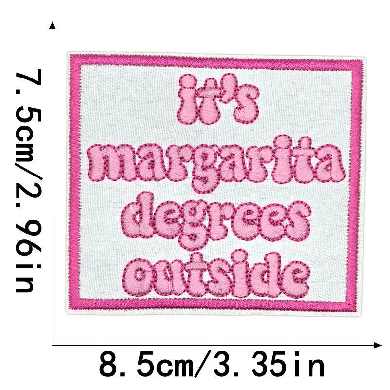 Pink embroidered patch with the text It's margarita degrees outside on a white background